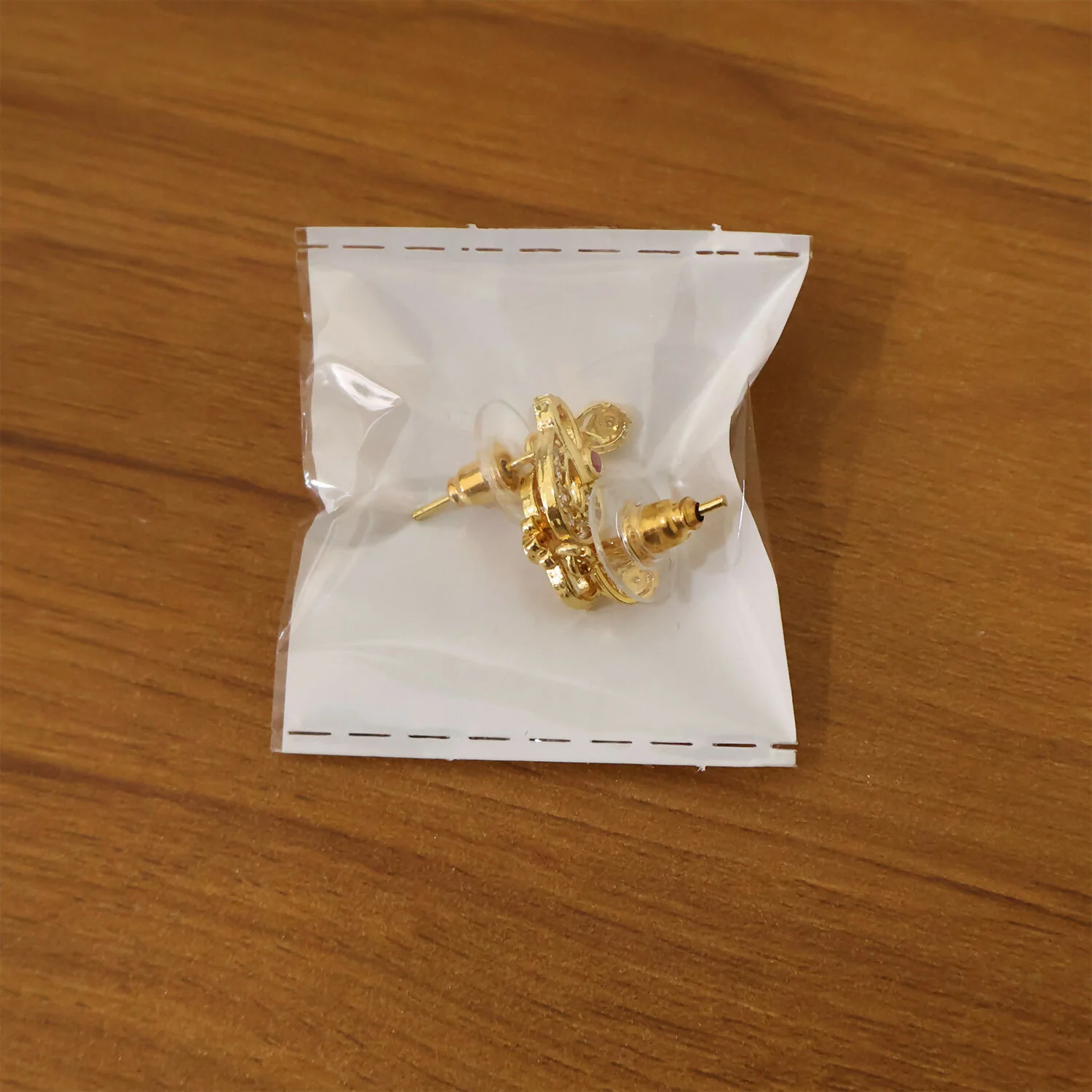 Classic Gold Finish Earrings with Crystal Detailing & Red Stone - Image 6