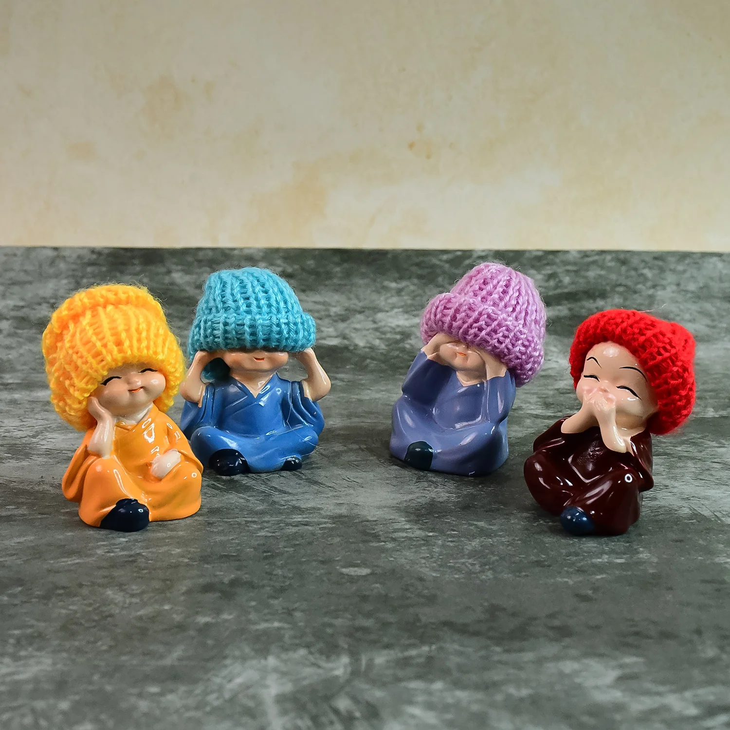 Decorative Resin Monk Buddha Showpiece Set of 4 with Traditional Straw Hats - Image 4