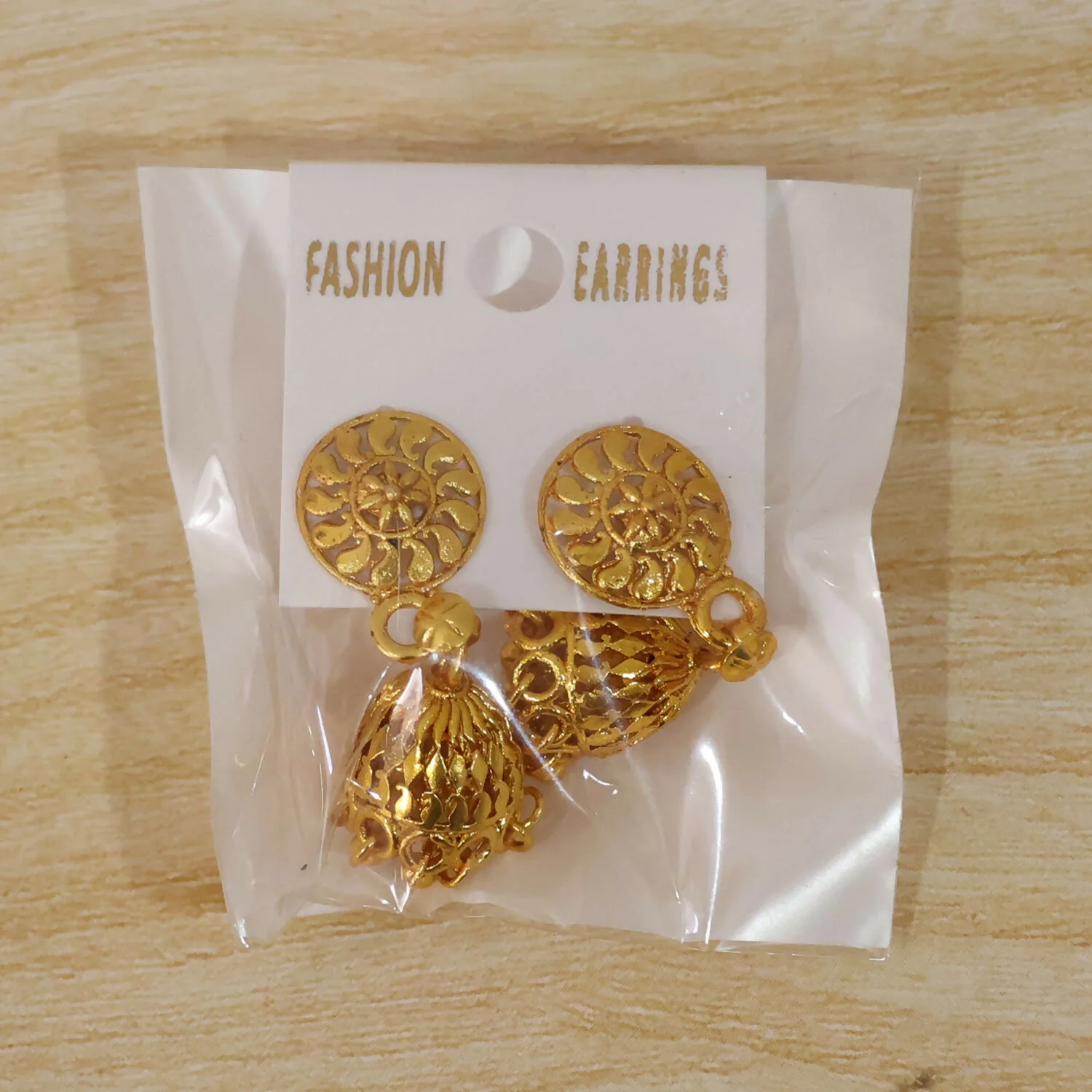 Detailed Gold Jhumka Earrings with Intricate Work and Pearl Accents for Festive Wear - Image 7