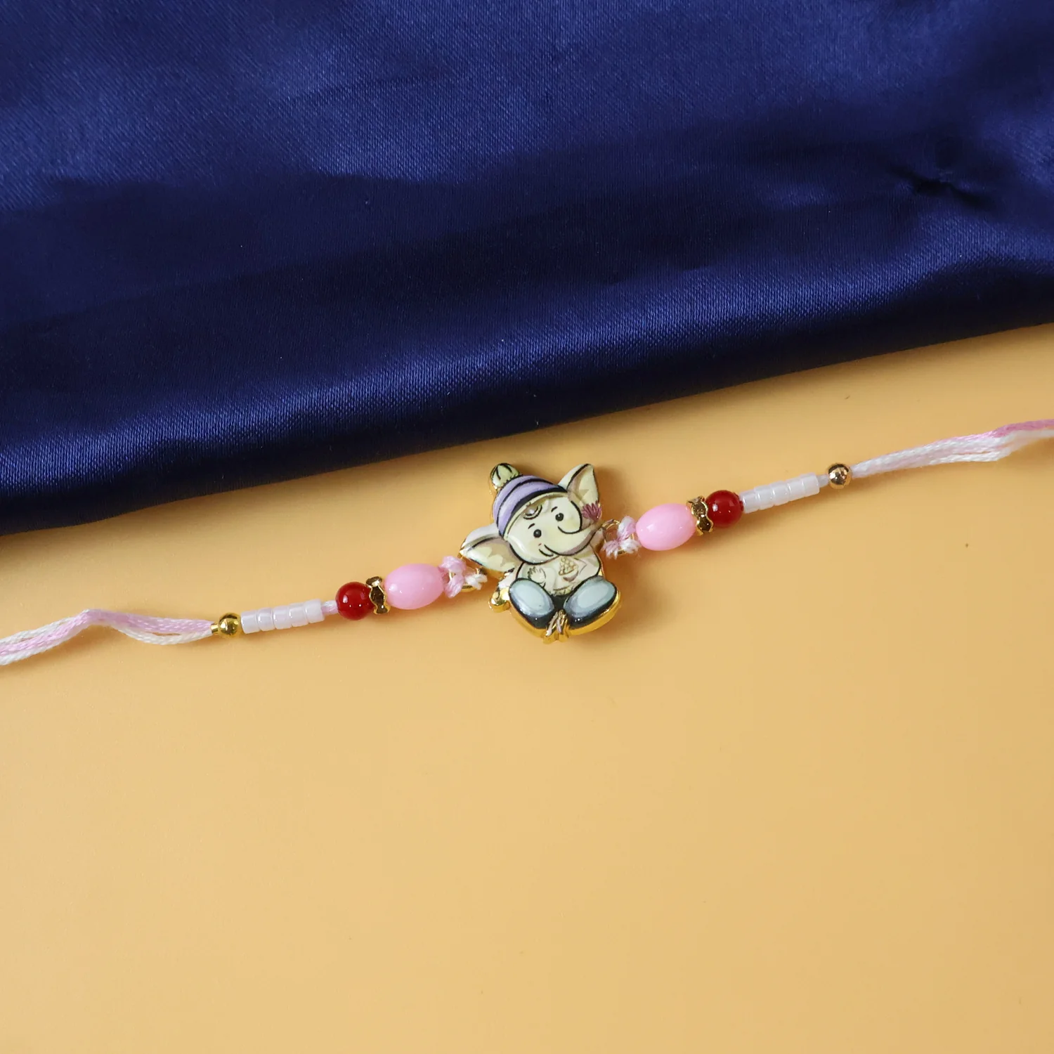 Cute Ganesha Designer Rakhi with Pink and Red Beads (1 Pc) - Image 5