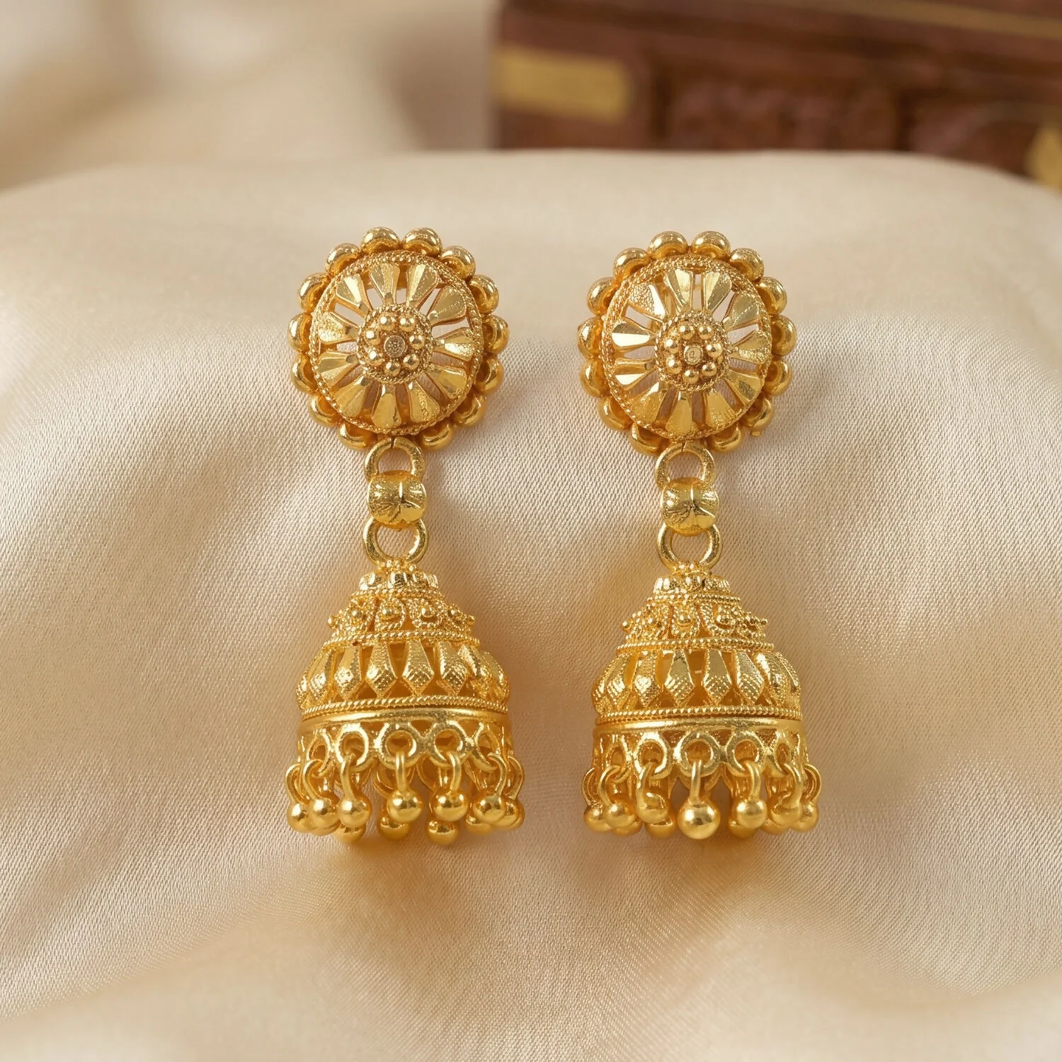 Elegant Gold Jhumka Earrings with Intricate Detailing and Pearls for Bridal Wear - Image 4