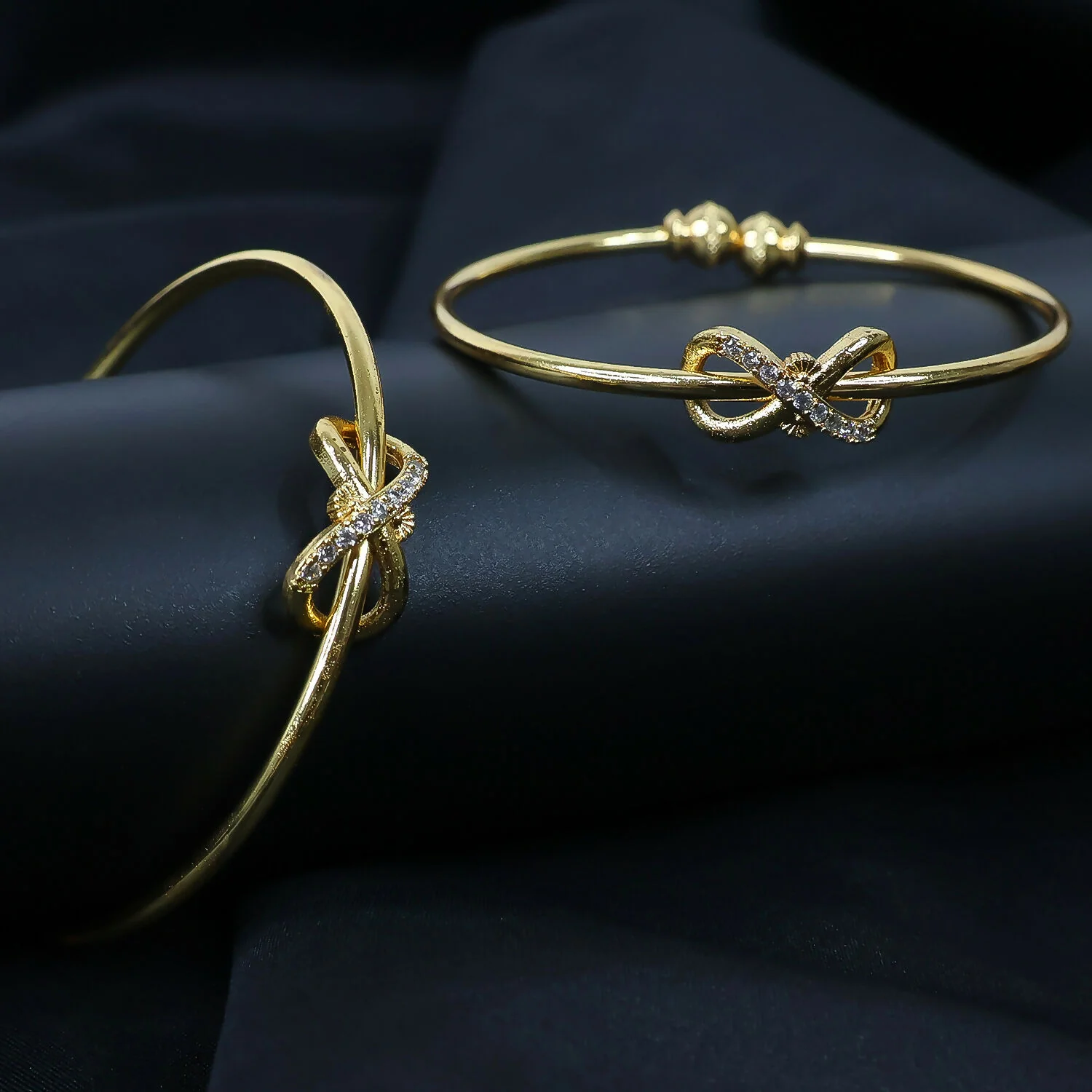 Elegant Knot Design Bangles with Stone Detailing - Image 2