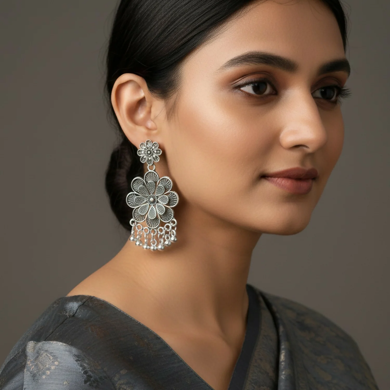 Elegant Oxidised Silver Jhumka Earings With Layered Floral Design - Image 2
