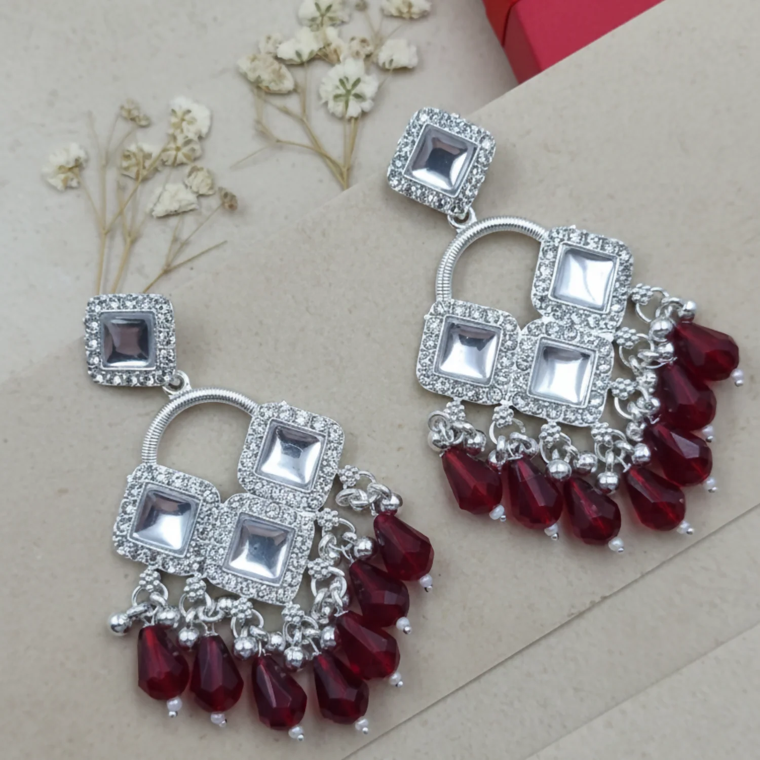 Elegant Silver Plated Chandelier Earrings Featuring Square Crystals and Maroon Teardrop Beads - Image 2