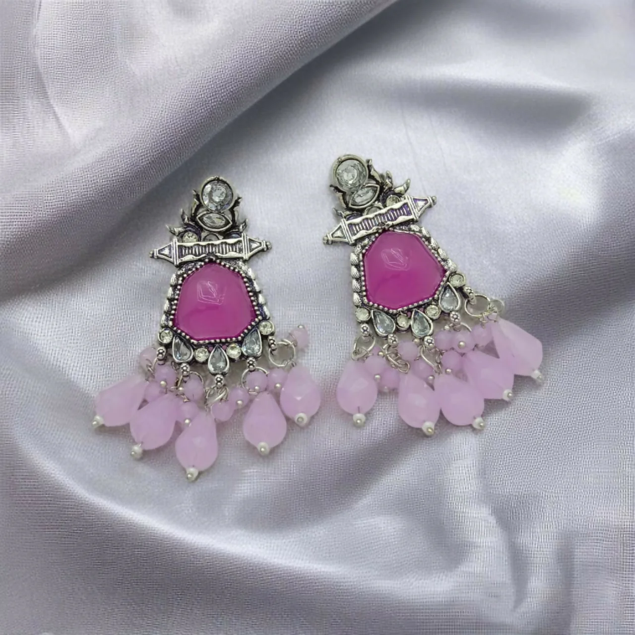 Vintage-Finish Tribal Jhumkas with Fuchsia and Light Pink Drops