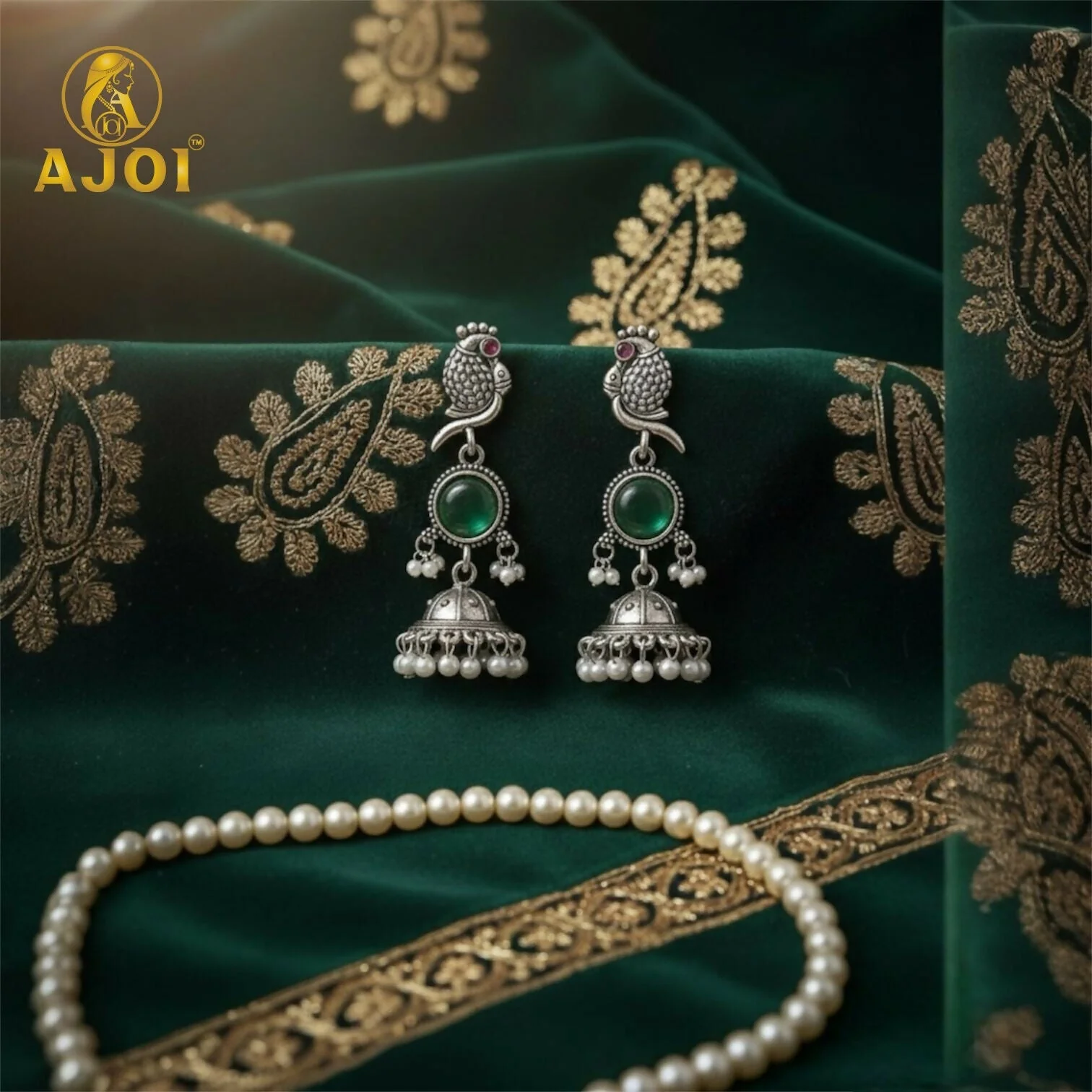 Handcrafted Antique Silver Peacock Jhumka Earrings with Emerald Green Stone & Pearl Drop Detailing