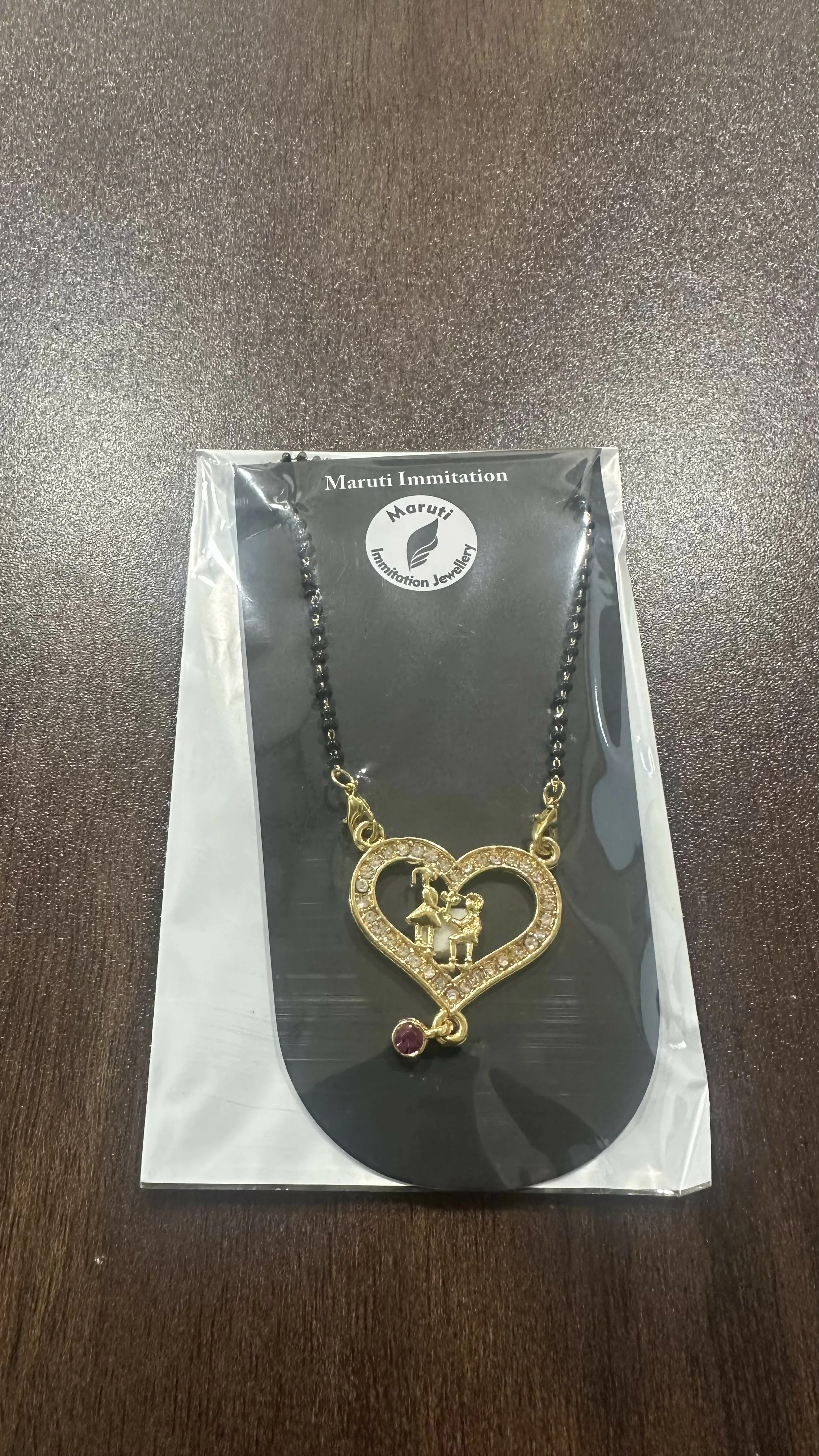 Gold-Tone Heart Mangalsutra with Intricate Couple Pendant and Stone Detailing - Image 4