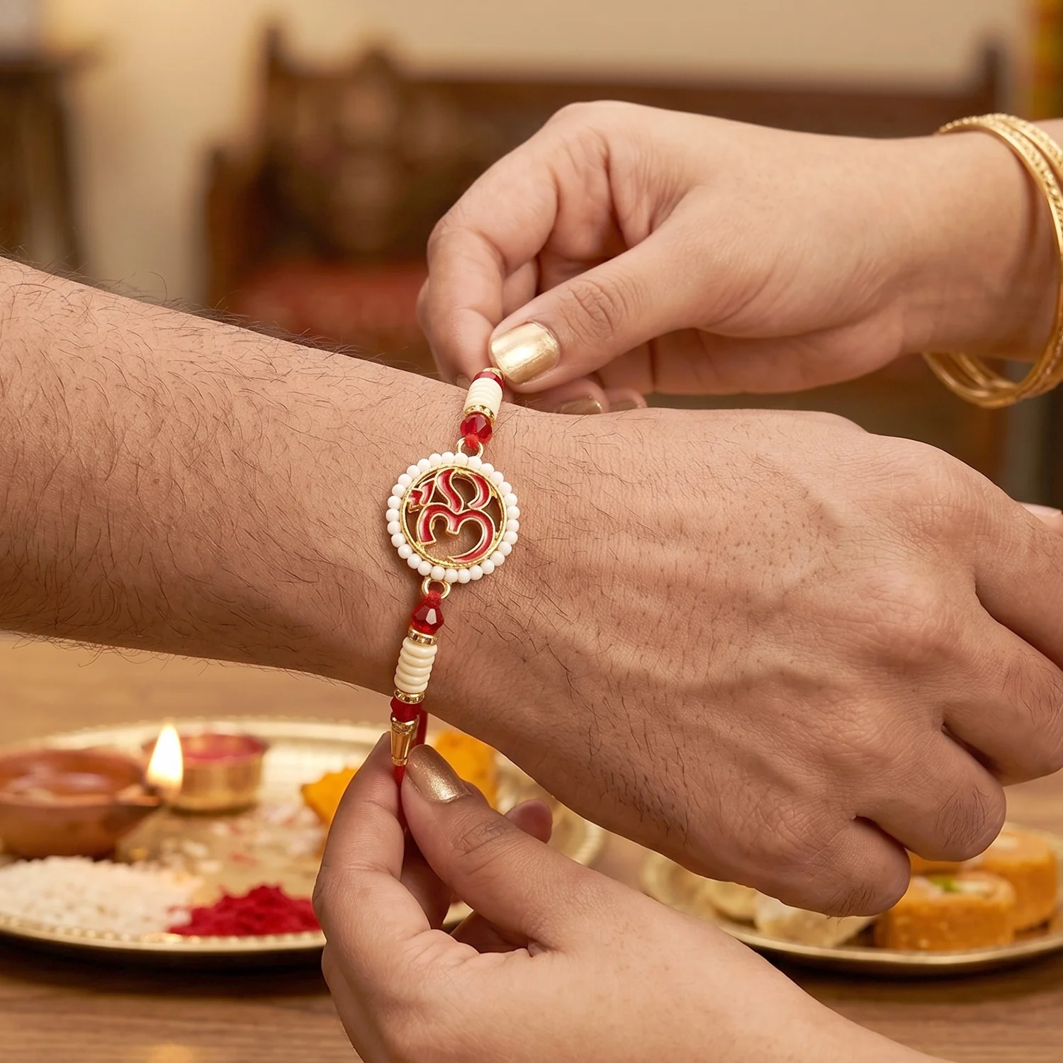 OM Symbol Pearl Frame Designer Rakhi - Image 2