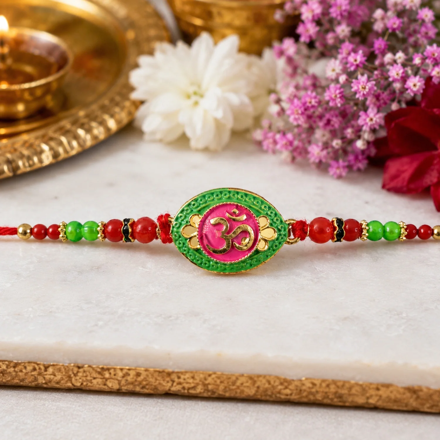 OM Symbol Pink Green Oval Designer Rakhi - Image 2
