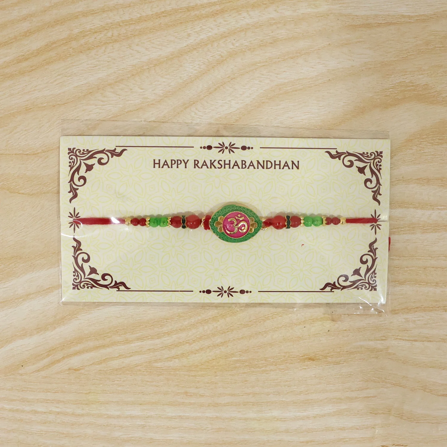 OM Symbol Pink Green Oval Designer Rakhi - Image 7