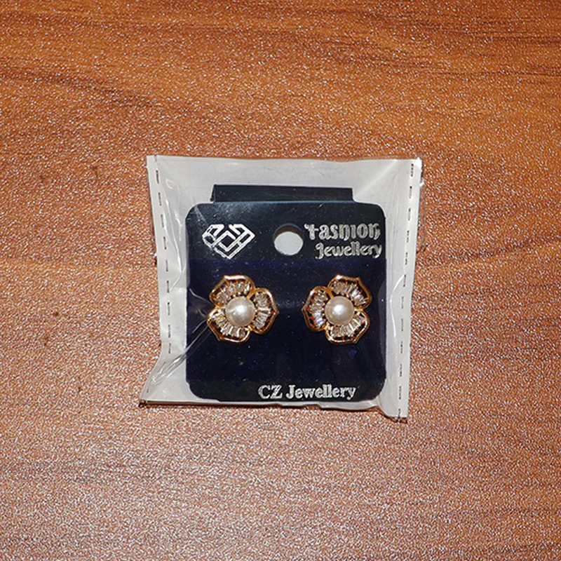 Pearl Center Floral Stud Earrings with Crystal Detailing and Gold Finish - Image 6