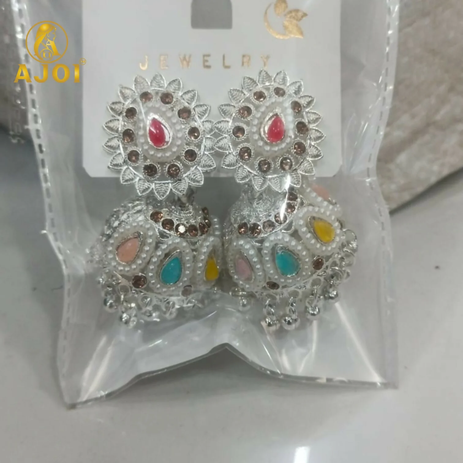 Royal Silver-Tone Kundan Jhumka Earrings with Multicolor Stone Inlay & Pearl Drop Detailing - Image 6
