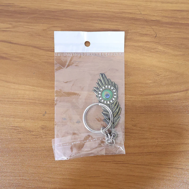 Stylish Mor Pankh (Peacock Feather) Metal Keychain – Elegant Crystal Accent Key Ring (Mix Color) (1 Pc) - Image 11