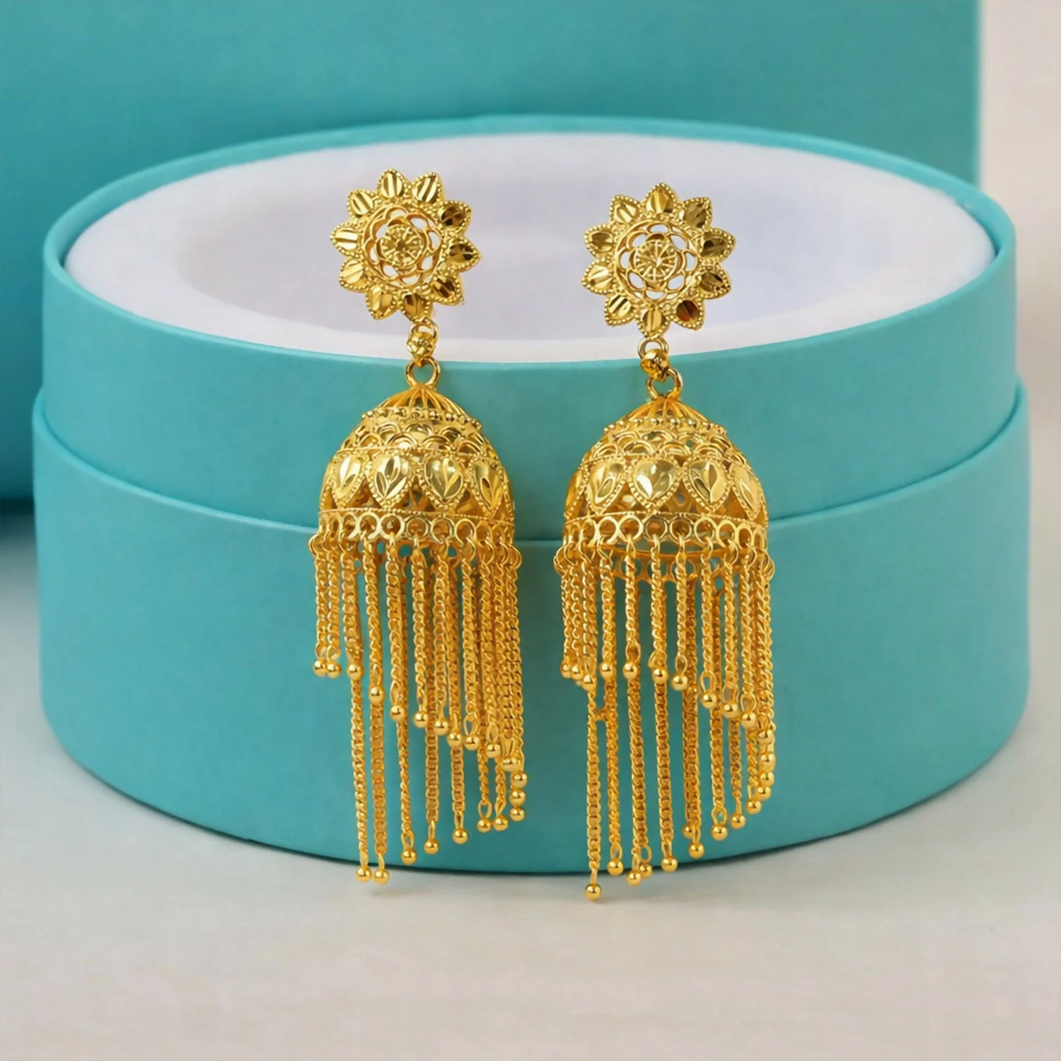 Traditional Gold Tone Floral Jhumka Earrings with Long Chain Tassel Design - Image 2